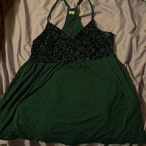 Cross tank top reaches to belly button. Worn by owner, not previously.